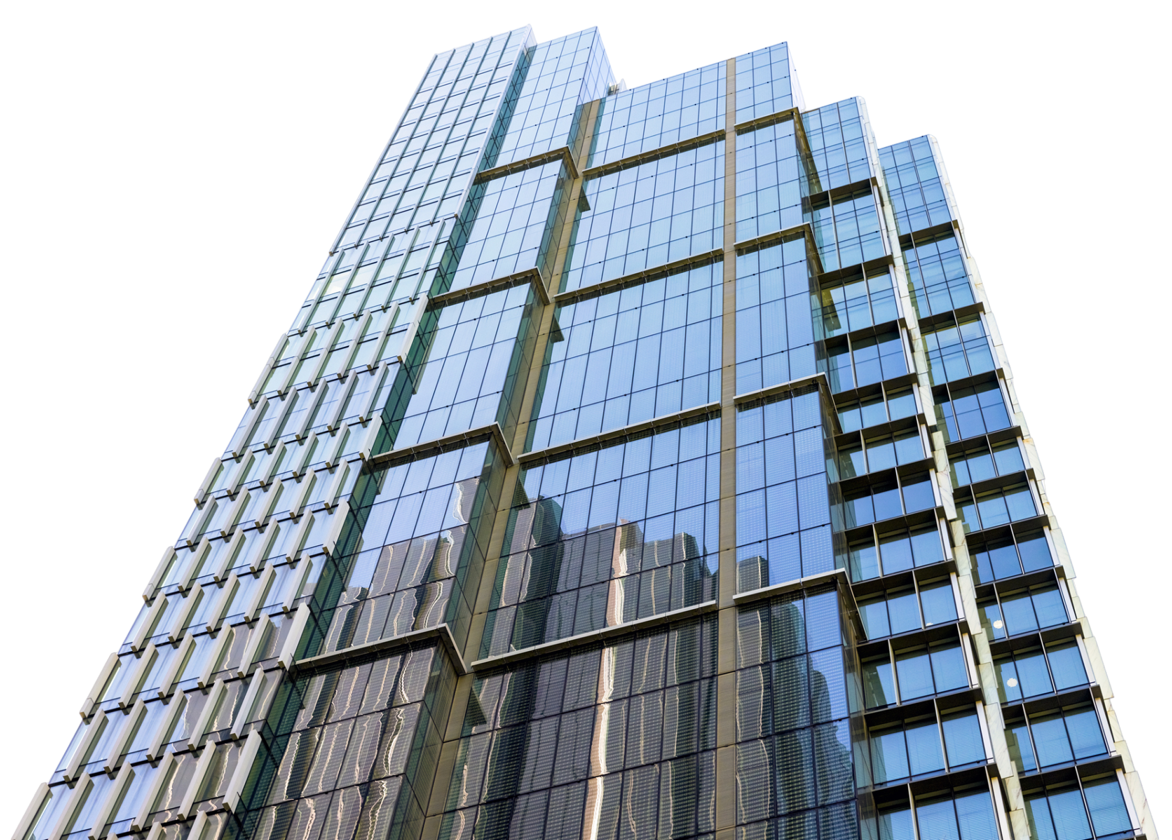 Modern glass skyscraper against black sky.
